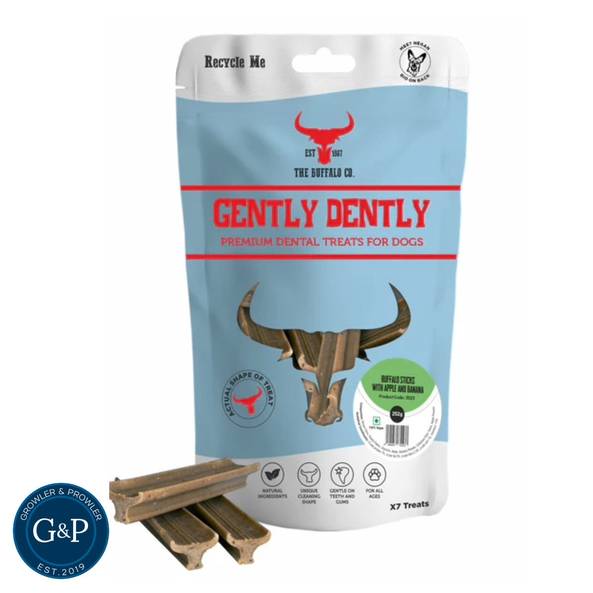 A package of Gently Dently Buffalo Sticks with Apple & Banana for dogs. The sticks are natural, grain-free dental treats that help clean teeth and gums. The package shows a dog holding one of the sticks.