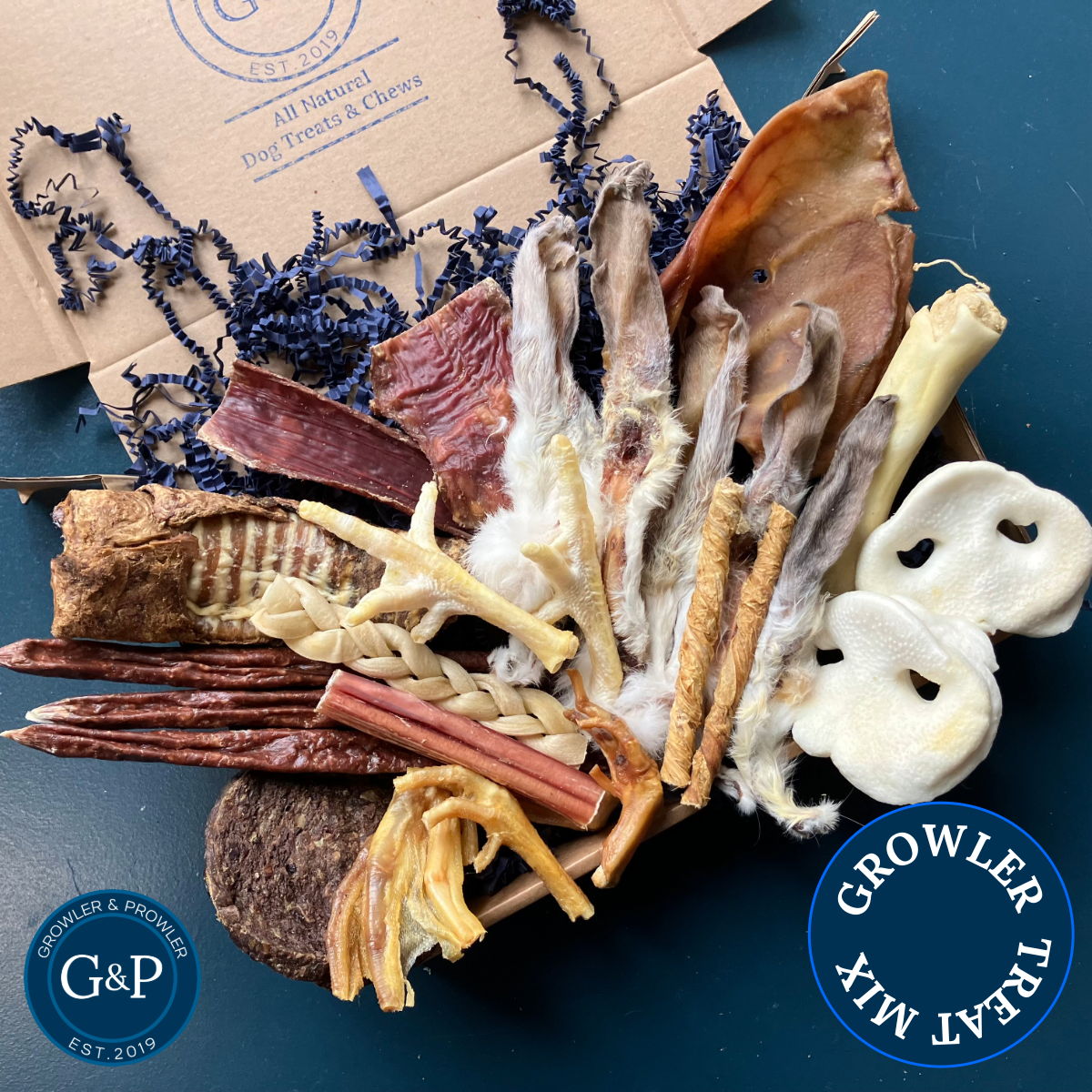 An assortment of natural dog treats in a decorative box from Growler and Prowler, a Manchester-based company.