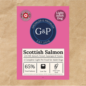 A brown paper bag of Growler & Prowler Scottish Salmon Light dog food. The bag features the company logo, information about the product, including the ingredients and nutritional content, and graphics of salmon, spinach, fennel, asparagus, and tomatoes. The bag also has a label indicating it's for light adult dogs.