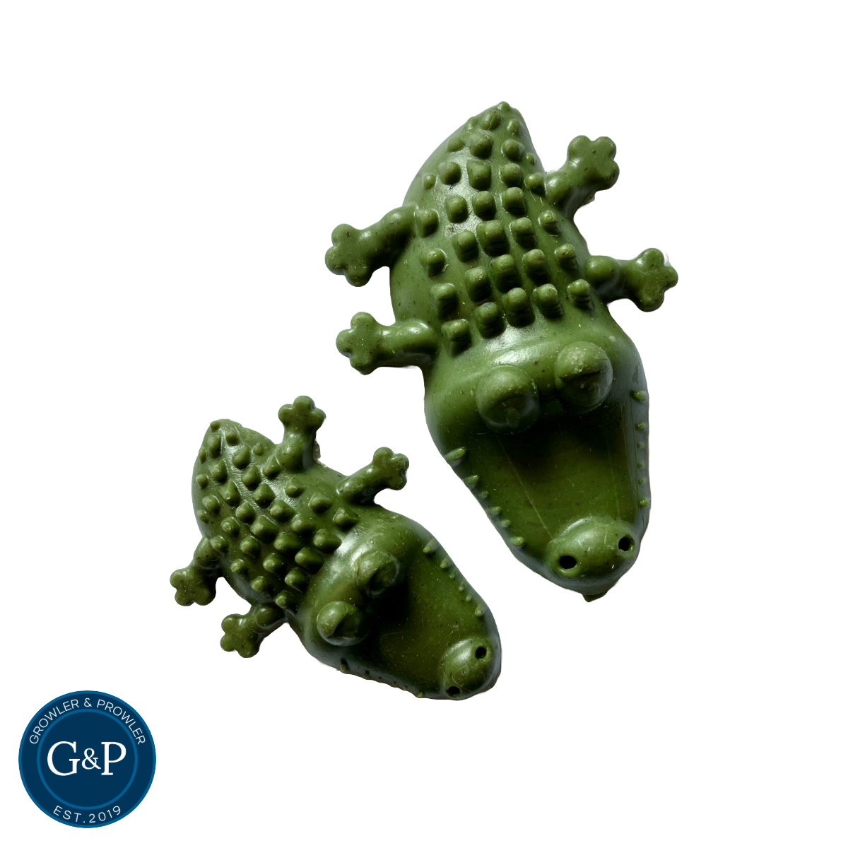 A pair of natural, veggie-based dog chews in the shape of crocodiles, made by Growler & Prowler