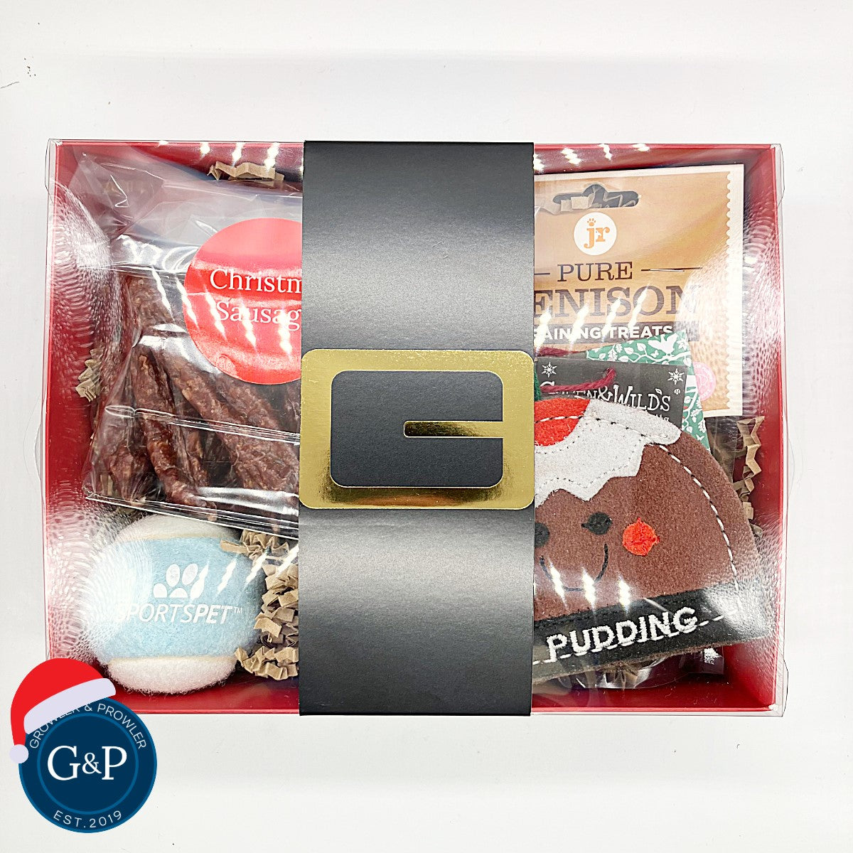 You Pudding Christmas box for dogs. Containing Christmas themed toys and treats for the idea gfit for your dog. Buy in Manchester at Growler and Prowler Pets,