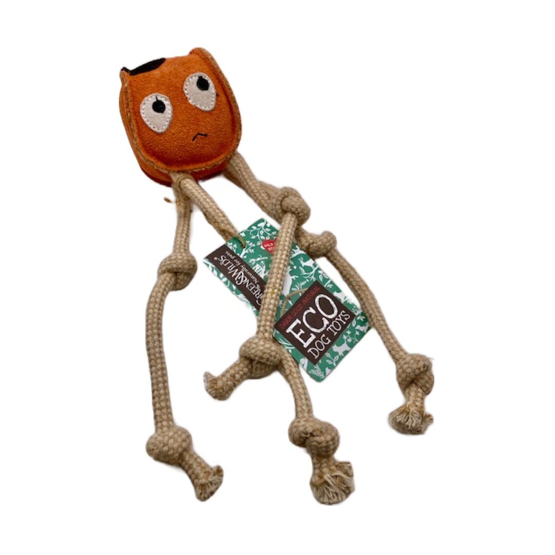 An orange, squid-shaped dog toy made from eco-friendly materials. The toy has four rope tentacles and a tag that says 'GREEN&WILD's ECO DOG TOYS'.