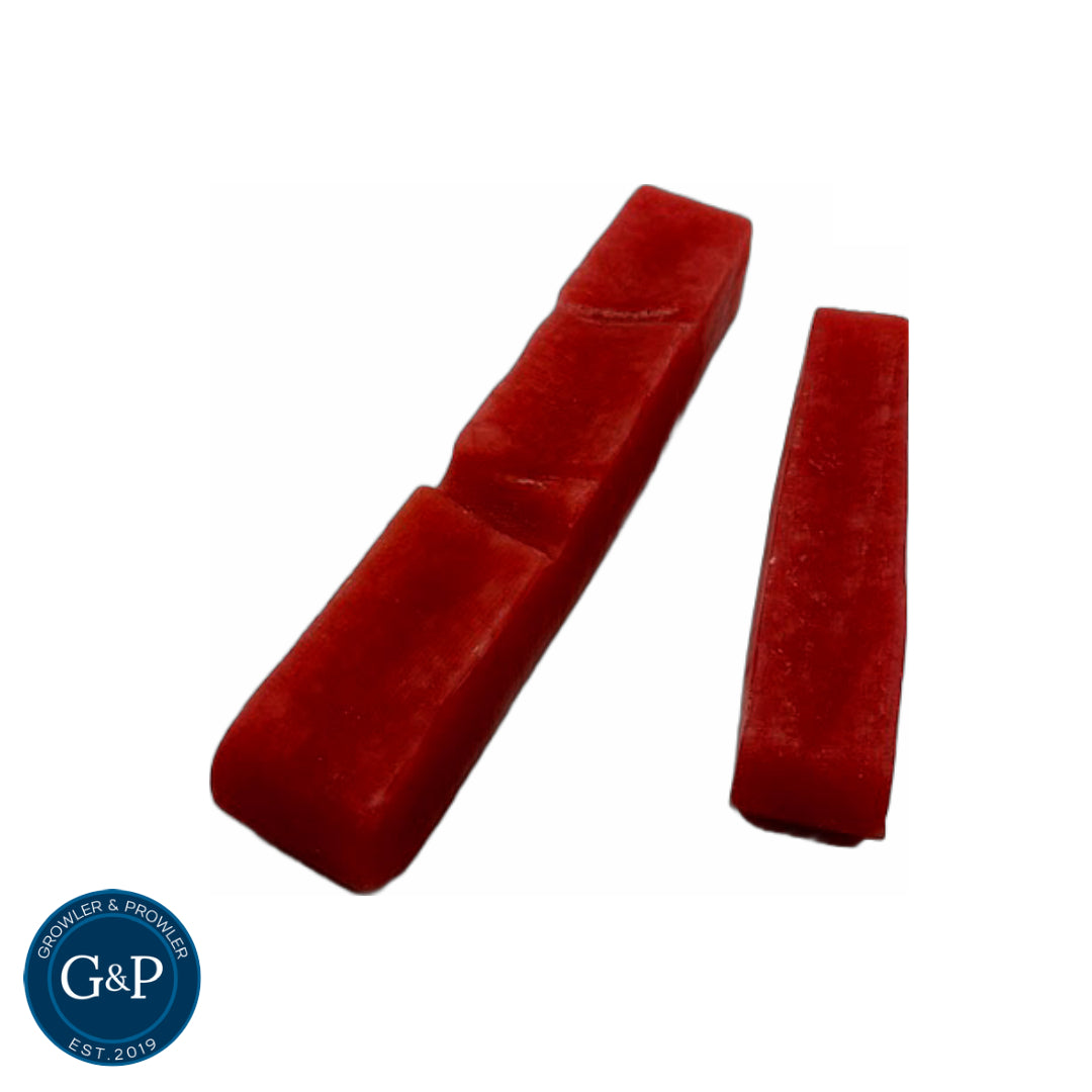 Red, rectangular dog chews made with strawberry and yak. Available at Growler & Prowler Manchester.